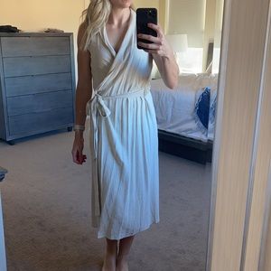 Sleeveless Woven midi wrap dress.